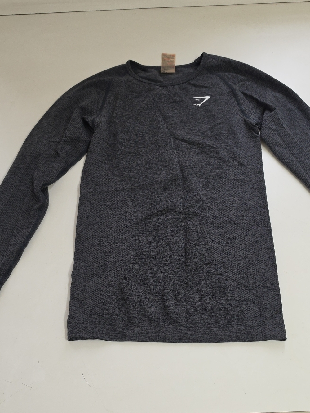 This charcoal Gymshark Vital Seamless long sleeve top features a subtle jacquard
